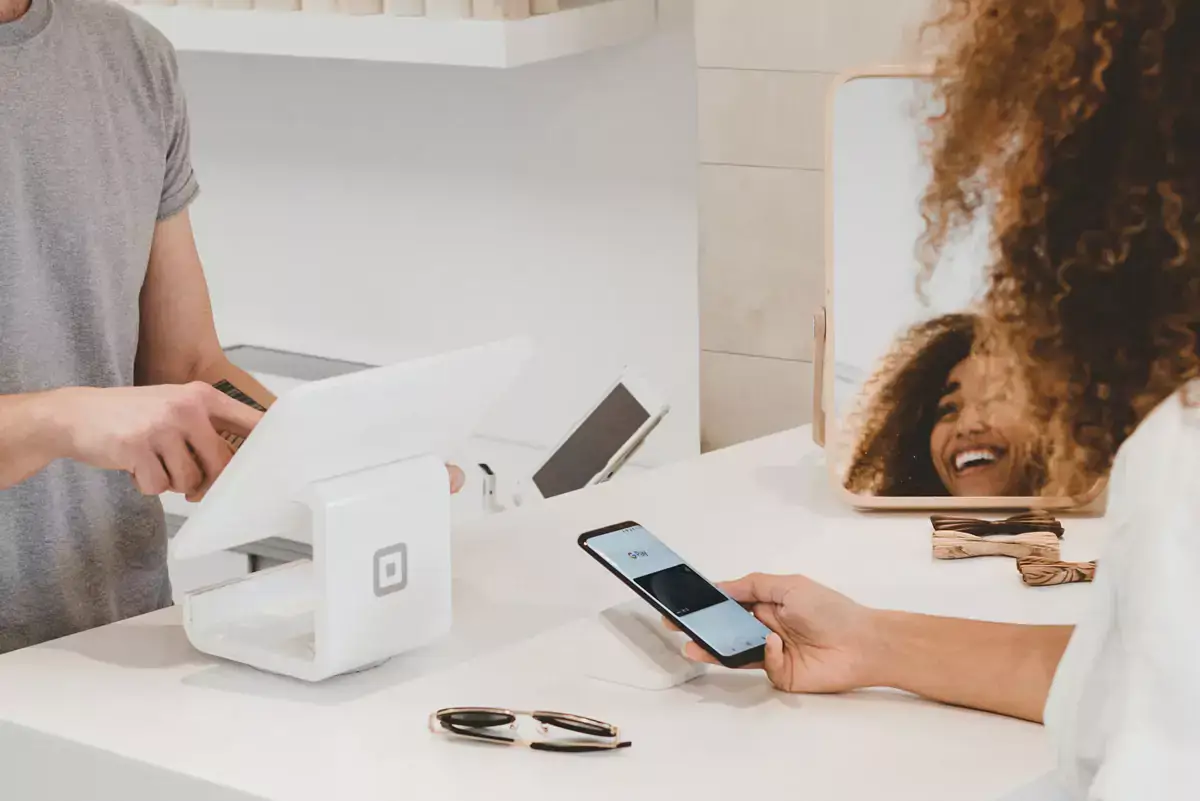 woman using google pay at a store